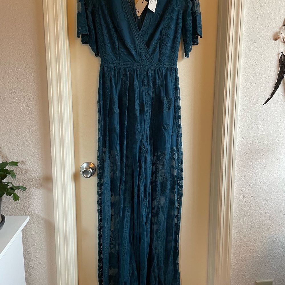 Teal lace jumpsuit with shorts underneath from Socialite. Brand NWT never worn.
